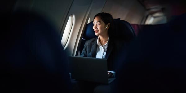 successful-asian-business-woman--business-woman-working-in-airplane-cabin