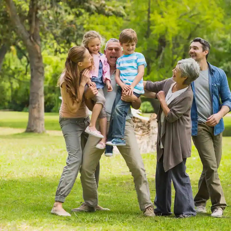full-length-of-an-extended-family-playing-in-the-park