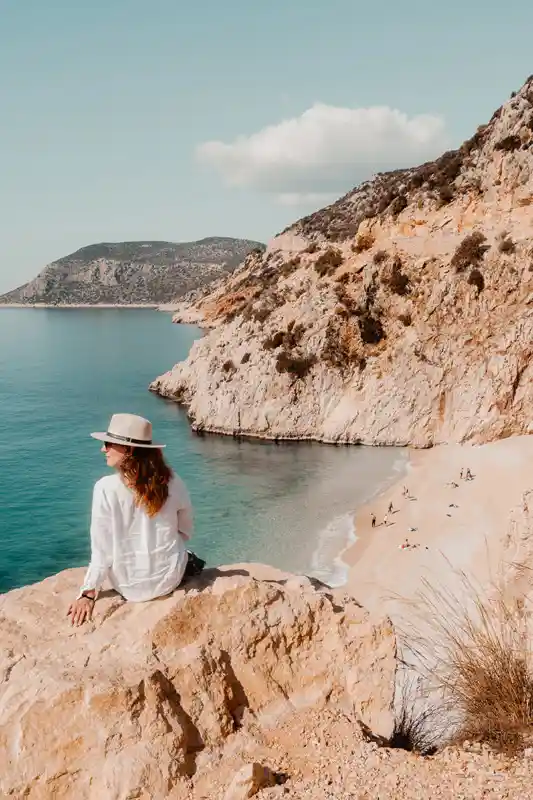 kaputas-beach-turkey---woman-on-the-rock-watching-a